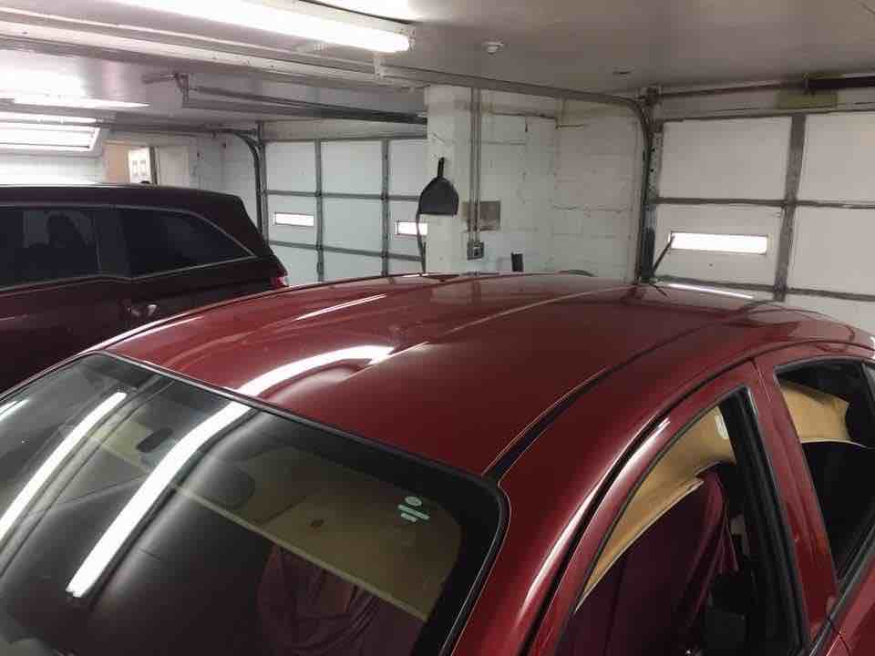 Paintless dent repair of dents across a car roof — after
