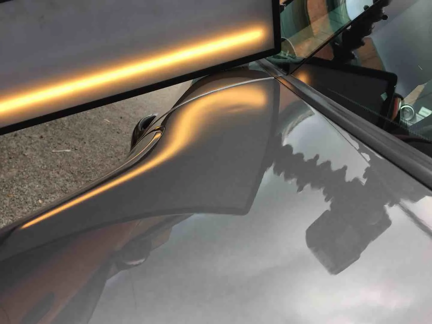 Door ding repair on a car door — before