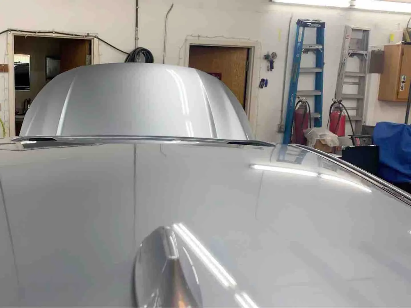 Hail damage repair on a car panel — after