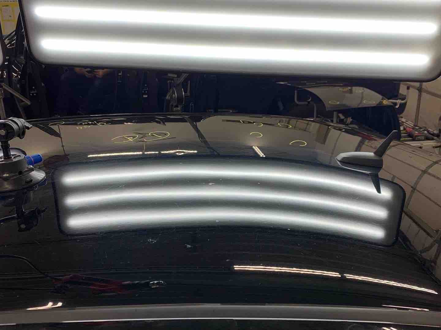 Hail damage repair on a car roof — after